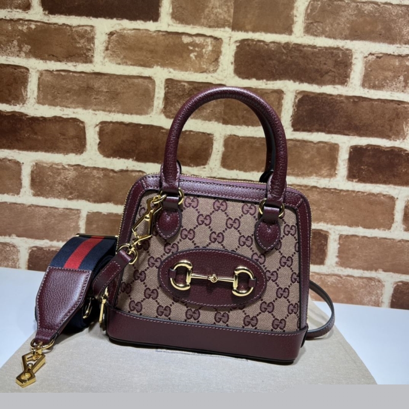 G*u*i top handle bags